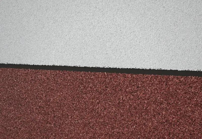 Two-tone wall: White above Red marble texture paint with a groove line