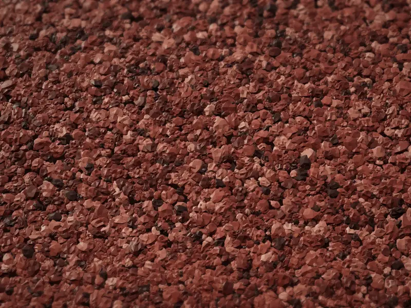 Red marble texture paint on a finished wall, close-up