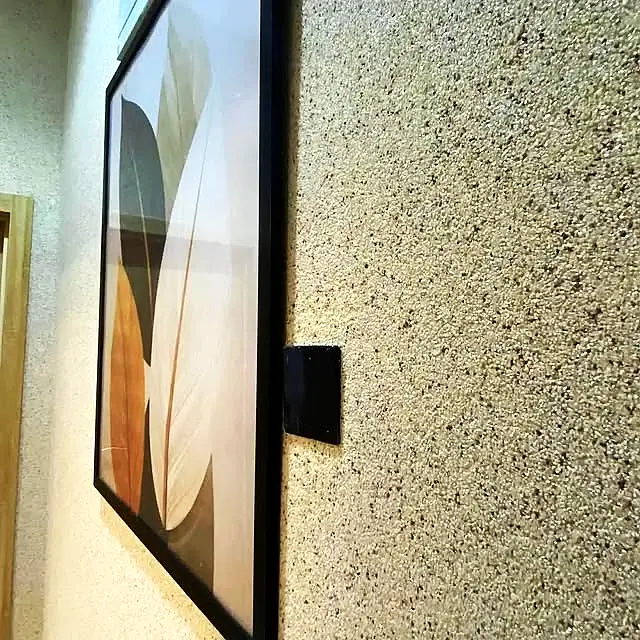 Light beige marble texture wall with a framed print
