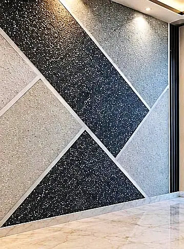 Feature wall with light and dark blocks split by steel lines