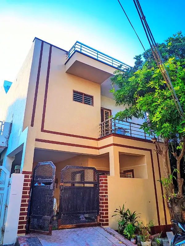 Cream house front with maroon lines